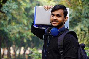 Indian student is going to attend his classes in college photo