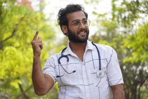 Happy medical student with stethoscope and showing and happy photo