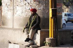 Poor homeless man in the street photo