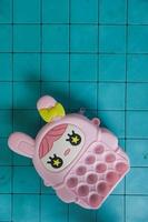pop it childrens toys combined into a small bag. cute pink object. photo