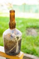vintage bottle, glass bottle for wine empty dirty kitchenware photo