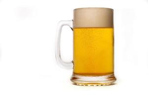 beer mug with foam on white background