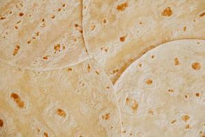 Texture of thin traditional freshly baked homemade oriental bread photo