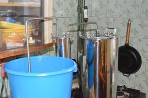 Moonshine still and parts for making distilled alcohol photo