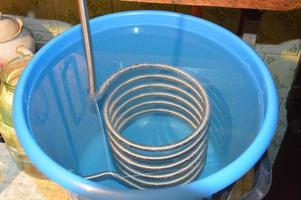 Moonshine still and parts for making distilled alcohol photo