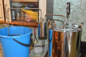 Moonshine still and parts for making distilled alcohol photo