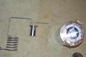 Moonshine still and parts for making distilled alcohol photo