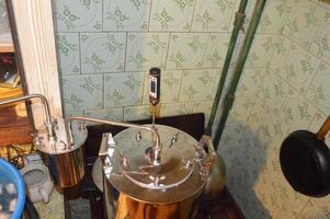 Moonshine still and parts for making distilled alcohol photo