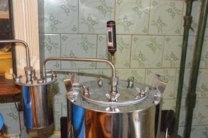 Moonshine still and parts for making distilled alcohol photo