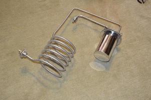 Moonshine still and parts for making distilled alcohol photo