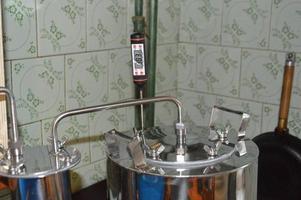 Moonshine still and parts for making distilled alcohol photo