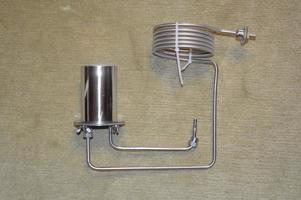 Moonshine still and parts for making distilled alcohol photo