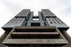 Abandoned high-rise building, cloudy weather, copy space. Unfinished shell construction. House of Soviets in Kaliningrad, Russia. photo