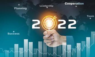 Business touch target and number new year 2022, innovative idea ofinspiration from online technology, Changes in new planning, Business growth, ideas and perspectives. photo