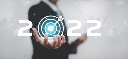 Business touch target and number new year2022 innovative idea of inspiration from online technology, Changes in new planning, Business growth, ideas and perspectives. photo