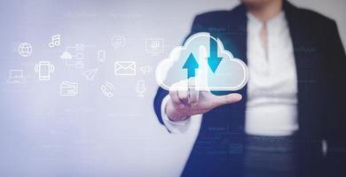 Businesswoman touching a cloud networking concept and touch screen with hand connection line on the black background, Cloud computing is system for sharing download and upload big data information, photo
