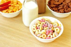 Bowls with different sorts of breakfast cereal products, white bowls with morning meal photo