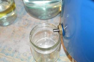 Moonshine still and parts for making distilled alcohol photo