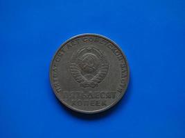 Vintage Russian ruble coin over blue photo