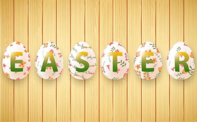 Wooden background with set ornamental Easter eggs