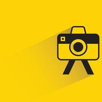 camera on stand yellow background vector