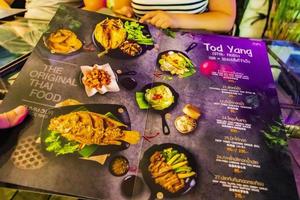 Bangkok Thailand 24. May 2018 Colorful menu with spicy Thai food in restaurant Bangkok Thailand. photo