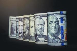 American Presidents on banknotes money stack on dark background. Selected focus photo