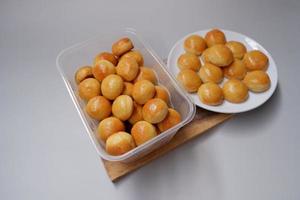 Nastar, as known as pineapple tart, is a traditional cake from Indonesia that made from flour, sugar, and butter with pineapple jam inside it. It's very popular during Eid Al Fitr or other holiday photo