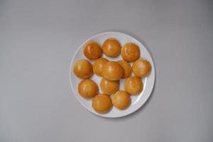 Nastar, as known as pineapple tart, is a traditional cake from Indonesia that made from flour, sugar, and butter with pineapple jam inside it. It's very popular during Eid Al Fitr or other holiday photo