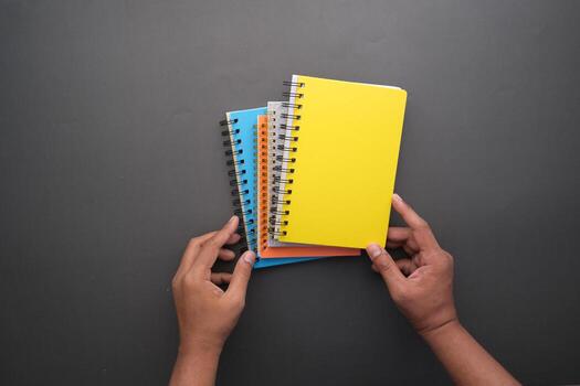 high angle view of color notepads on color background photo