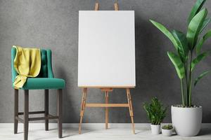 Blank canvas on wooden easel with plant photo