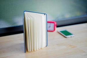 Hands and books that are laid bare with space In the morning room Book reading concept photo