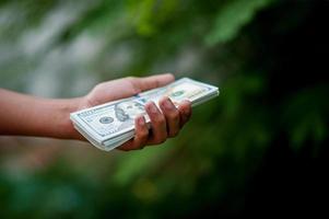 Hand and dollar pictures Concept of business finance photo