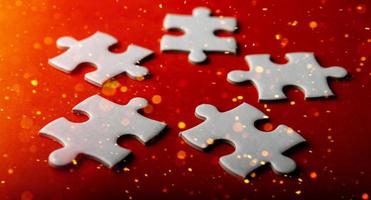White puzzles placed on an orange background Represent the unity and power of successful people photo