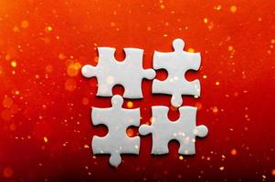 White puzzles placed on an orange background Represent the unity and power of successful people photo