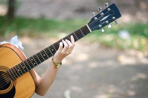 Musician hands and acoustic guitars, musical instruments with very good sound Musical instrument concept photo