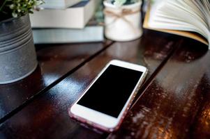 A telephone placed on an office desk photo