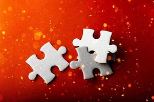 White puzzles placed on an orange background Represent the unity and power of successful people photo