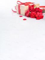 May mothers day handmade giftbox wishes photography - Beautiful blooming carnations with red ribbon bow box isolated on modern marble desk, close up, copy space, mock up photo