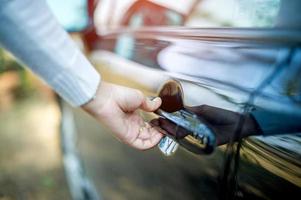 Hand and car doors, opening doors, concept cars, driving safely photo