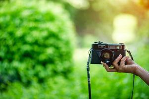 Hand and camera Of professional photographers Concept photographer photo