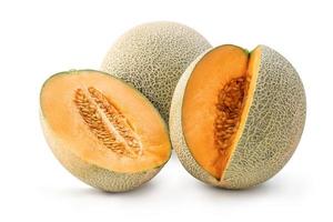 Close up, clipping path, cut out. Beautiful tasty sliced rock cantaloup melon isolated on white background photo
