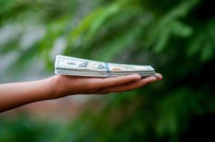 Hand and dollar pictures Concept of business finance photo