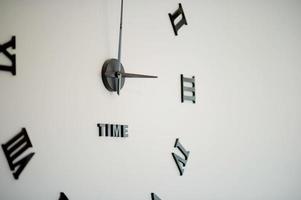 Beautiful wall clock In a clean white bedroom photo