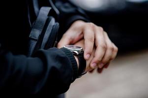 Gentlemen's hands and watches Like wearing a wristwatch And punctuality photo