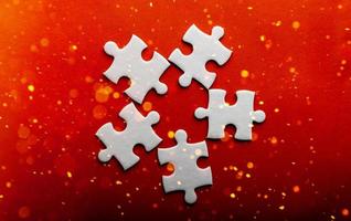 White puzzles placed on an orange background Represent the unity and power of successful people photo