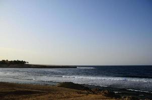 beach and sea with horizon photo