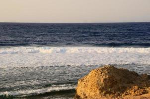 beach with waves and horizon photo