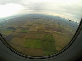 view of airplane many fields photo