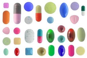 Many colorful pills isolated on white background photo